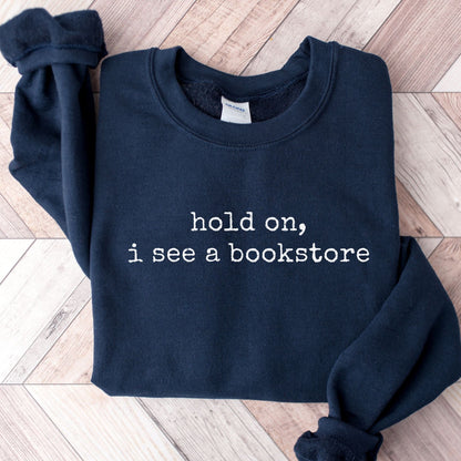 Hold On, I See A Bookstore Unisex Sweatshirt